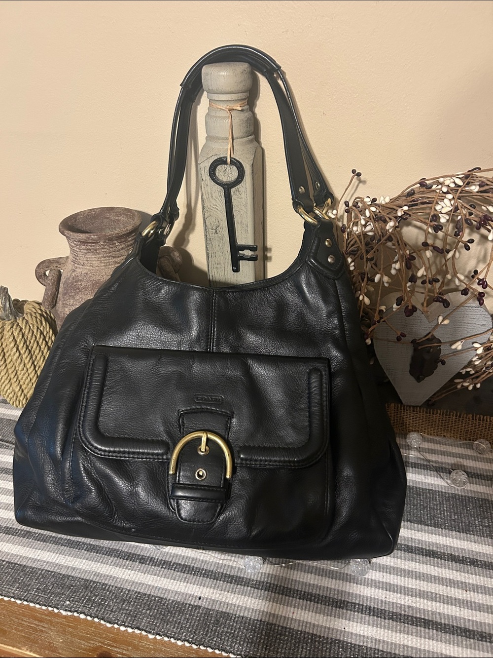 Coach Black Leather Shoulder Bag with Front Buckle Pocket and Gold Hardware